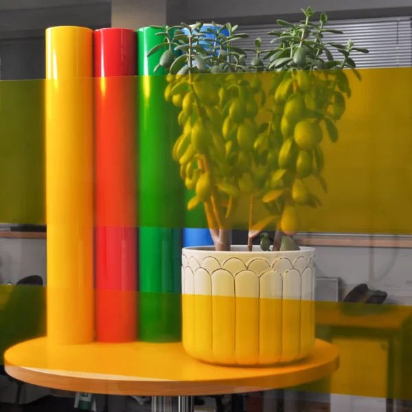 MACcrystal 8407-01 Deep Yellow transparent window film sample applied to an internal office window to show the level of transparency and the decorative colour transformation effect that this self-adhesive colour tint vinyl provides.