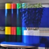MACcrystal 8437-04 Deep Blue coloured window tint film applied to an internal office window to show the level of transparency and the colour transformation effect that this transparent decorative self-adhesive vinyl provides.