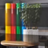 MACcrystal 8487-02 Grey self-adhesive colour tint window vinyl sample applied to an internal office window to show the level of transparency and the decorative colour transformation effect that this film offers.