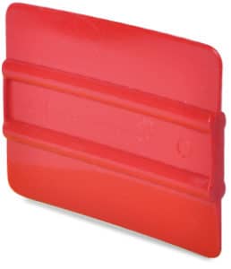 4 inch bright red ribbed soft plastic squeegee with Mactac branding subtley embossed in the middle between the two central ribs.