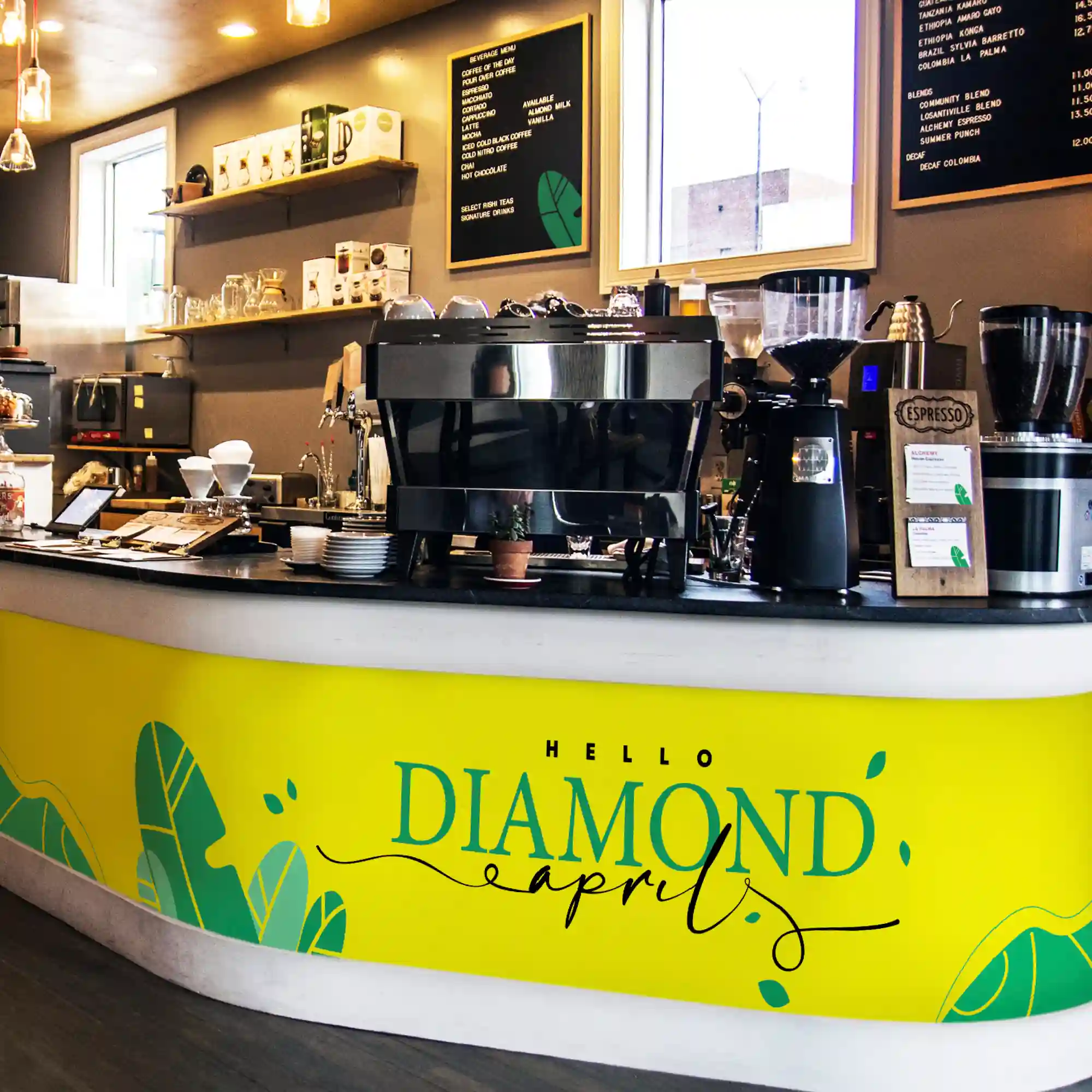 Mactac 9300 self-adhesive sign films used for the signage and decorative branding of the interior of this coffee shop, using various colours from the range, including yellow, two shades of green vinyl and black.