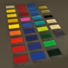 The colour card for Mactac 9700 coloured lightbox films placed onto a graphics lightbox with the backlit illuminated colours shining out as the light travels through the translucent colours, really making them stand-out from the dark background surrounding the samples.