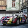 Modern art style printed vinyl graphic laminated with Mactac cast gloss vehicle wrap laminate, LF 10700 CG-UV, parked in juxtpsition against a contrasting old, rustic courtyard in the background.