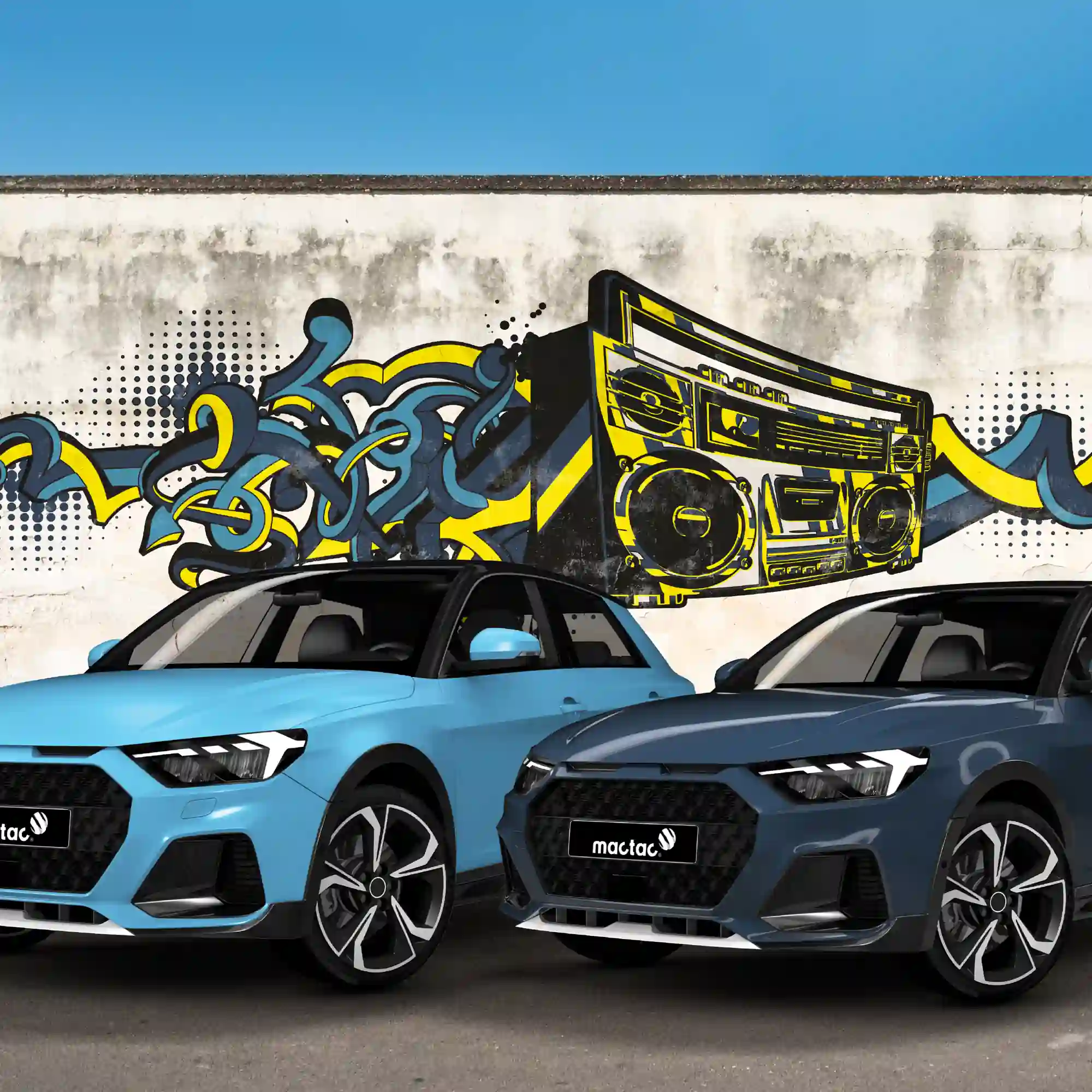 Mactac Colourwrap Series vehicle wrapping vinyls, gloss Light Blue and Night Blue colour options, applied to two vehicles posed with front wheels turned slightly and parked in front of a printed piece of graffiti inspired, ghetto blaster wall art behind them.