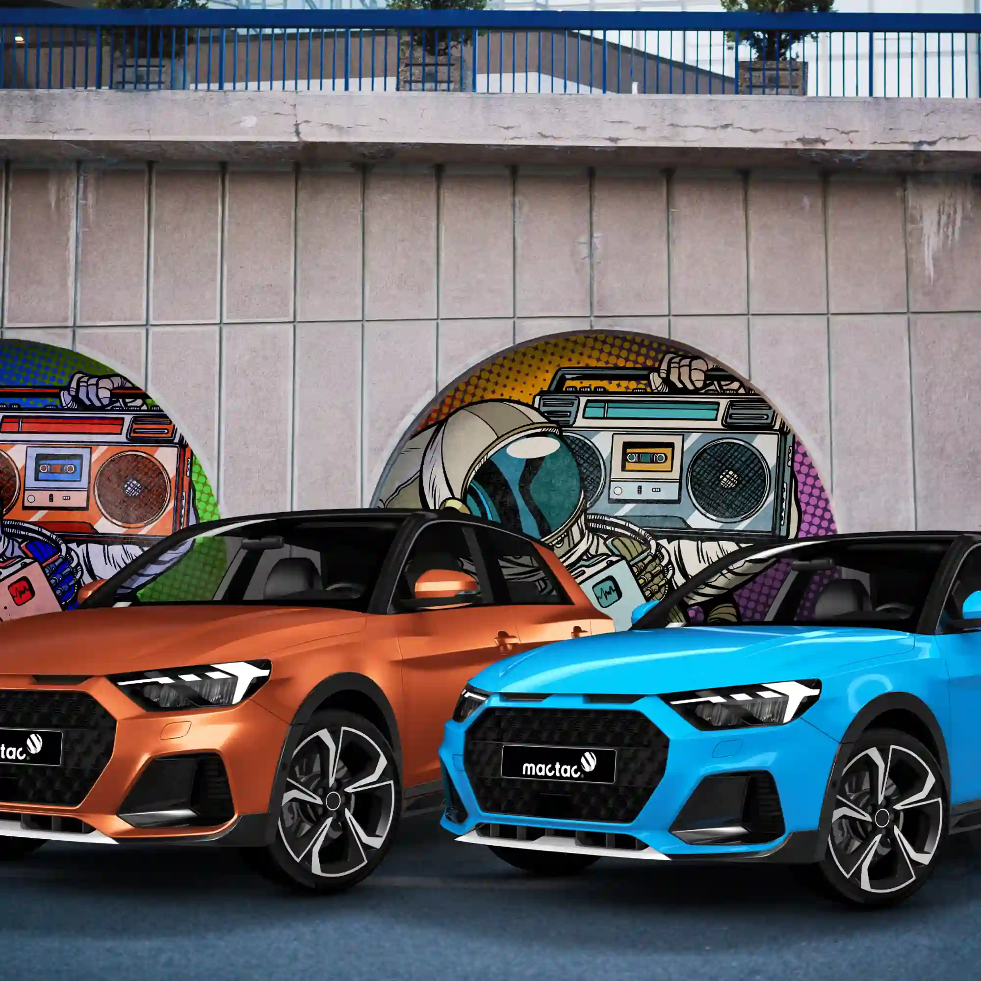 Metallic satin and matt colour wrap films from Mactac's Colourwrap series of cast wrapping vinyls; on the left a road car has been colour transformed with Satin Copper and on the right the vehicle is wrapped with Matt Metallic Blue film. Parked in front of a concrete tile patterned concourse there are indented alcoves that have printed graphics applied into the recesses behind the cars.