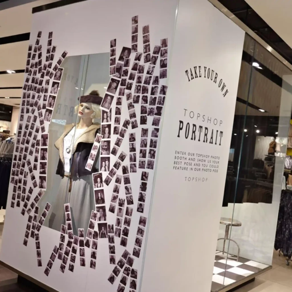 Retail signage finished with Mactac LF8500 CM economical clear matt print laminate for a smooth, glare-free look, adorn and protect an in-store photo booth display graphic that is placed within a famous British fashion retailers store with details of a featured promotion.