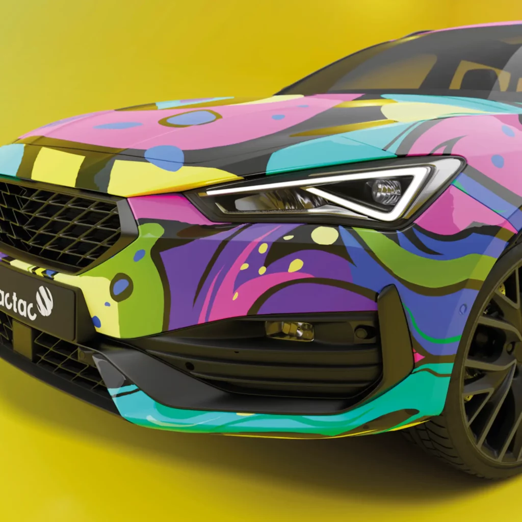 Mactac JT 10800 WG-BFG vehicle wrapping vinyl with a printed abstract, brightly coloured design installed over the complete body of a modern car, fully applied into it's deeply curved, contoured surfaces.