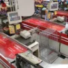 JT 5826 P very soft matt white PVC material for self-adhesive printed applications onto plastisiced banners, applied here onto a string of supermarket conveyor belts.
