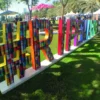 LF 8700 CG-UV gloss print laminate covers all printed graphics, including UV inks, and is pictured here protecting self-adhseive prints that have been applied to the exterior surfaces of a 3-dimensional text art installation at an outdoor festival.