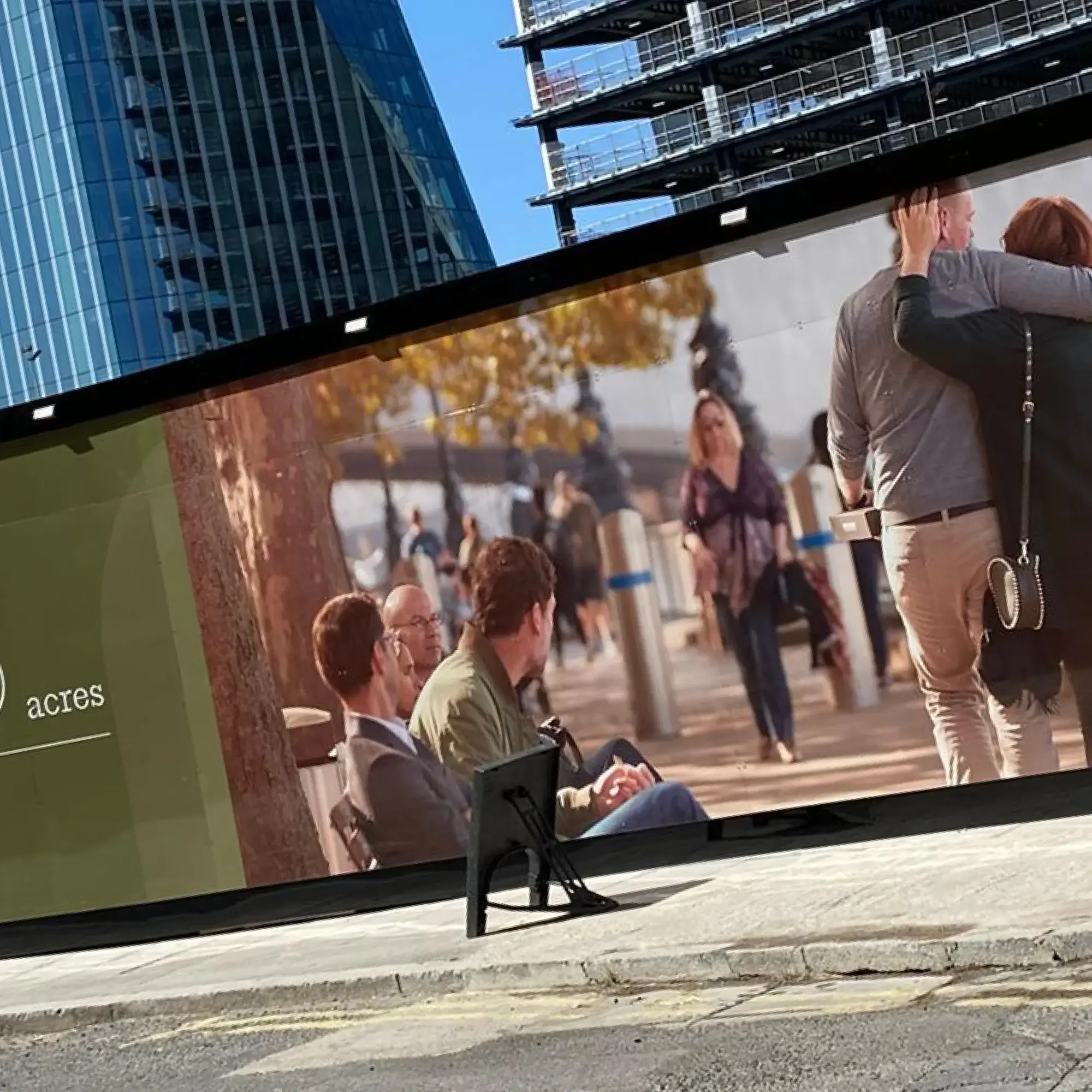 Mactac PG 7036 anti-graffiti laminate overlaminated onto a large format printed advertising graphic and applied to protect external building construction site hoardings from spray paint vandalism damage and to extend the life of print graphics.