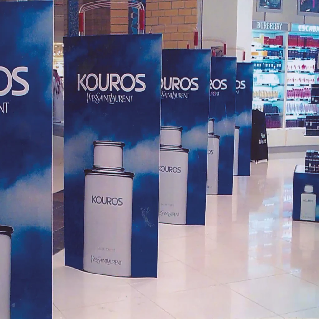 Mactac polymeric print graphic laminates covering and protecting the printed images of these retail promotional displays that are lined up at a store entrance, welcoming visitors.