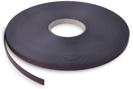 The brown coloured Magnetic Tape, MTA type A for rear of pop-up display panels, is shown here in its 33M long reel, coiled into a tidy, tight reel with the leading edge trailing into the foreground towards the viewer away from the coil shape.