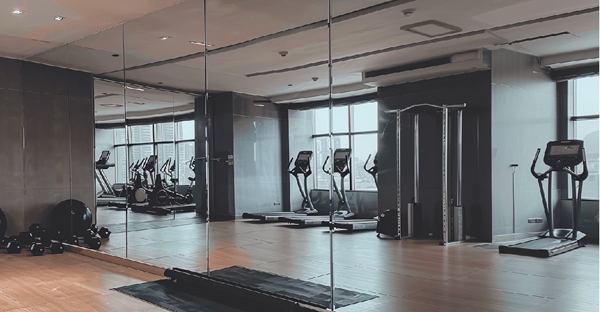 MS19 Total Mirro Silver self-adhesive film used to create this floor to ceiling mirror wall in a gymnasium, you wouldn't beleive this isn't a true glass mirror!