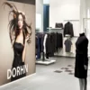 Avery Dennison MPI 2000 HOP high opacity gloss white print film with a grey opaque self-adhesive covers over anything beneath the film, perfect for applications such as promotional retail signs and the like, as used in this clothes store as part of the retail display graphics.