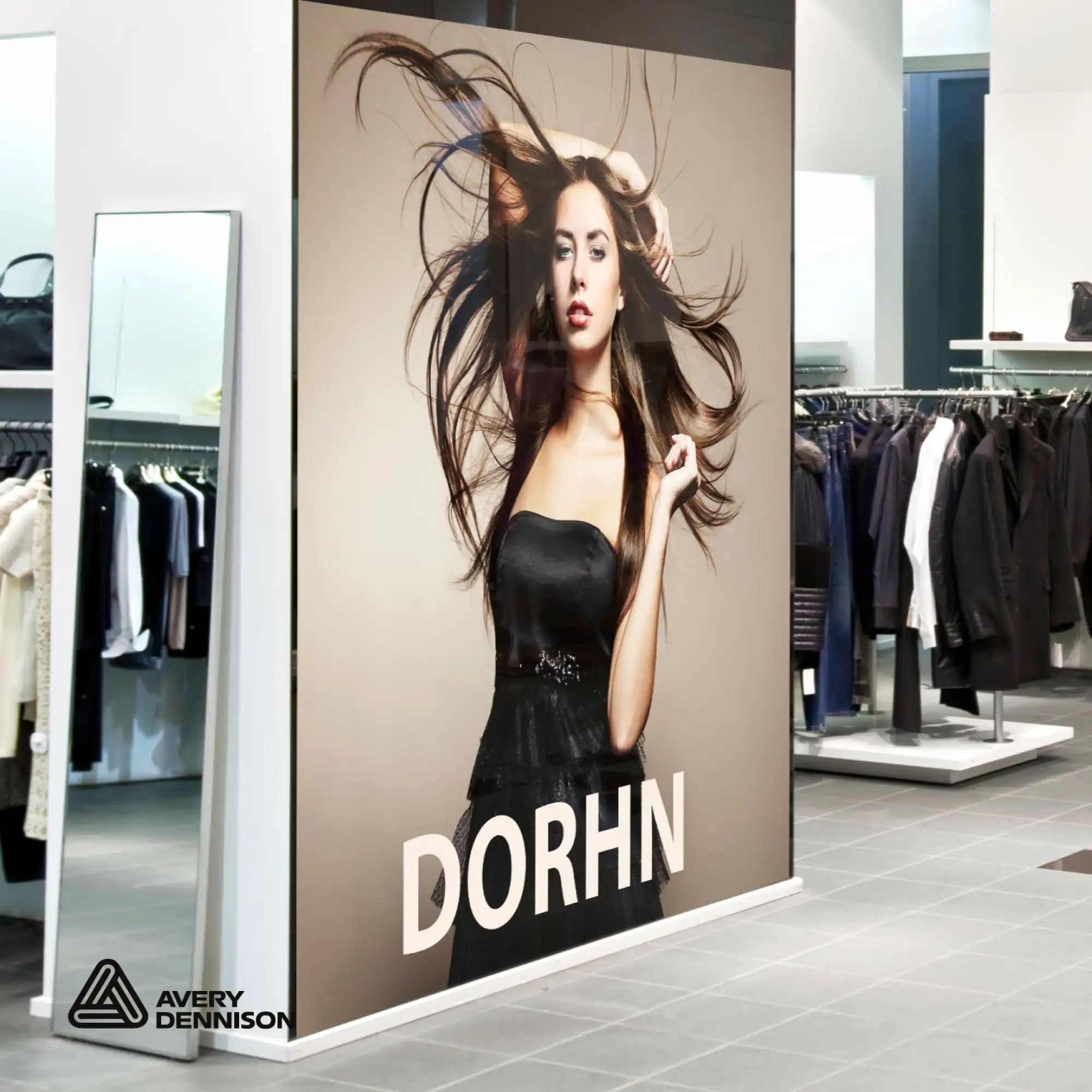 Avery Dennison MPI 2003 features a repositionable grey self-adhesive but is still part of the "Standard Opacity" series. A gloss white print vinyl for promotional display prints and large size graphics applied to a partition wall as part of the in-store advertising in this clothing retail store.