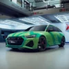 Avery Dennison's MPI 1104 EA PW vinyl wrap film has been applied to the exterior contours of this modern car with a printed green and blue abstract design and sits proudly completed in the wrapping unit bay.
