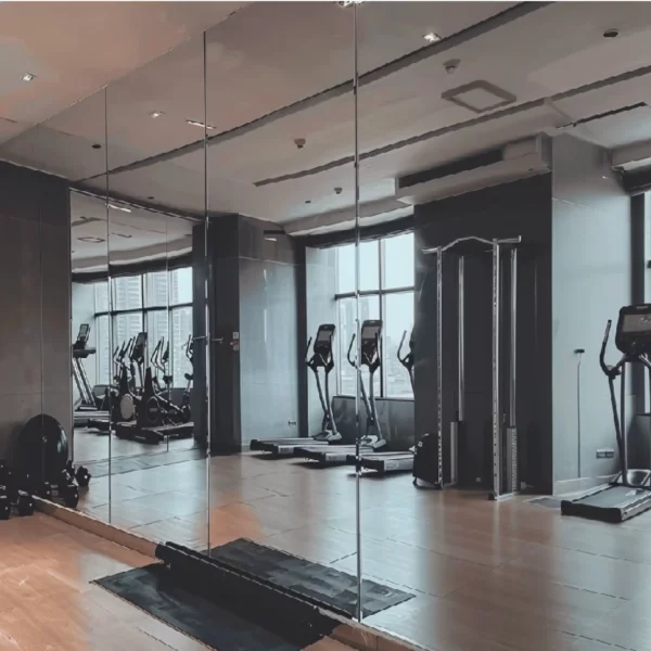 MS190 self-adhesive silver metallised high gloss reflective vinyl provides a glass-like, total mirror surface. Applied here floor to ceiling to create a complete mirrored wall for a gymnasium / ballet practice room.