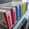 Nazdar 133 Series solvent ink for digital printers using SS21 ink in JV33 or CJV30 machines, pictured here are a full set of ink cartridges inserted horizontally. At the front shown in a row, from left to right; Magenta, Light Magenta, Cyan , Light Cyan, Yellow and Black carts.