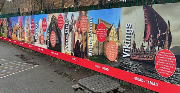 NU-COAT P11-P-P gloss white polymeric print film for longer term self-adhesive printed graphics applied to this shool playgrounds perimiter display hoarding boards.