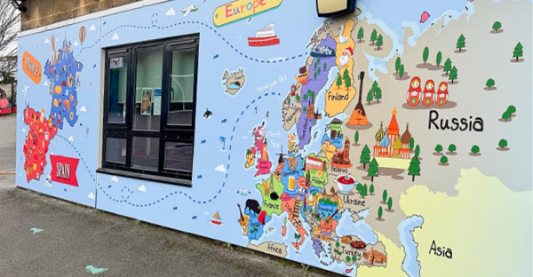 P21-P polymeric print film and transparent gloss laminate brightening up a corner of a school playground area with large size educational graphics.