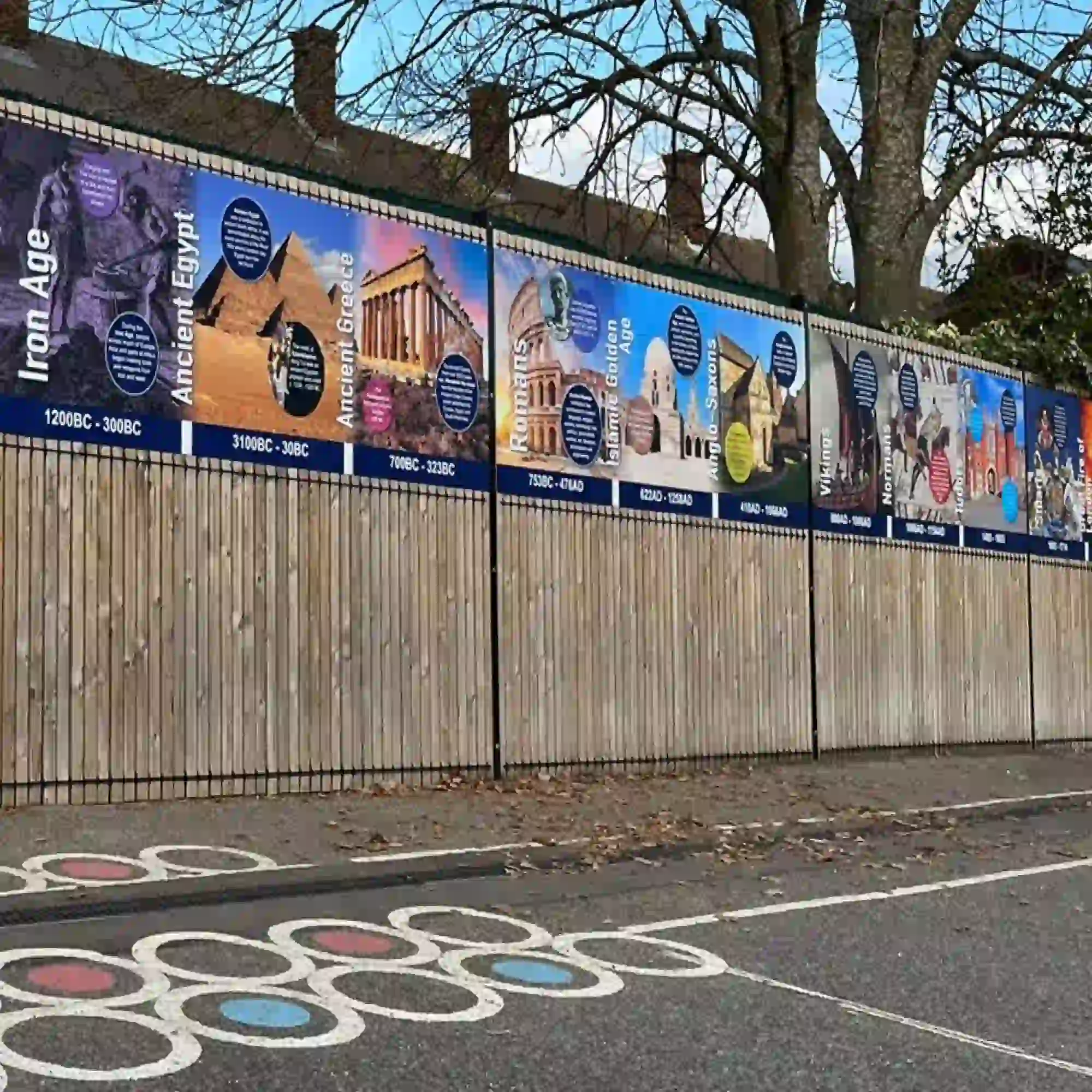 NU-COAT polymeric print vinyls with permanent adhesive are a series of print films for longer term printed graphics on flat and curved surfaces. Applied here to decorative and educational display boards mounted onto the exterior tall fences of a school's permimeter.