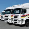 NU-COAT Nu-Sign ‘P’ Series polymeric sign vinyls - red, yellow and blue decals from the full range of colours applied to a fleet of branded white trucks.