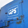 NU-COAT 'P' Series white sign vinyl cut-out All Print Supplies logo decal stuck to the side of an external skip door.