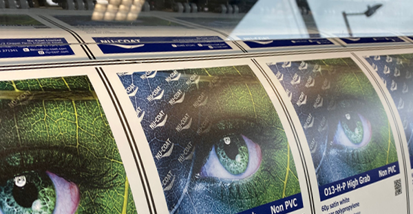 O13-H-P non-PVC print film with HighGRAB adhesive being printed on a wide format printer, imposed artwork can be seen to produce many sets of promotional samples.