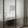 OC100 Opal Crystal self-adhesive window film adds a decorative etch-glass effect to this meeting room window, offering cut-vinyl design capability as seen in this photo whihere a geometric hexagon style pattern has been weeded out form the vinyl leaving large areas of the film on the surface for window obscurity, providing excellent privacy.