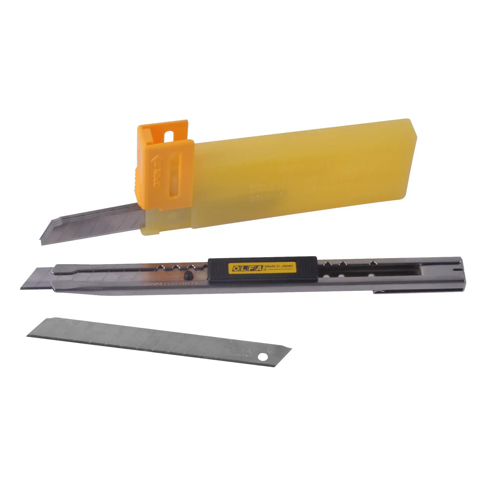 OLFA SVR-2 retractable snap-off knife, a slimline stainless steel construction with retractable blade detailing the mechanism for retracting the 45° blade at the centre of the photo. Also included in the pic are the replacment blades in the blade protection case and an individual blade - the objects are fanned out in a semi-oval shape.