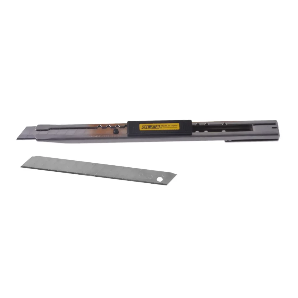 OLFA SVR-2 knife with retractable 45 degree angled blade for vinyl cutting and graphic arts, with a spare stick of snap-off 45° angle blades separate and below the slimline stainless steel handle/knife housing.