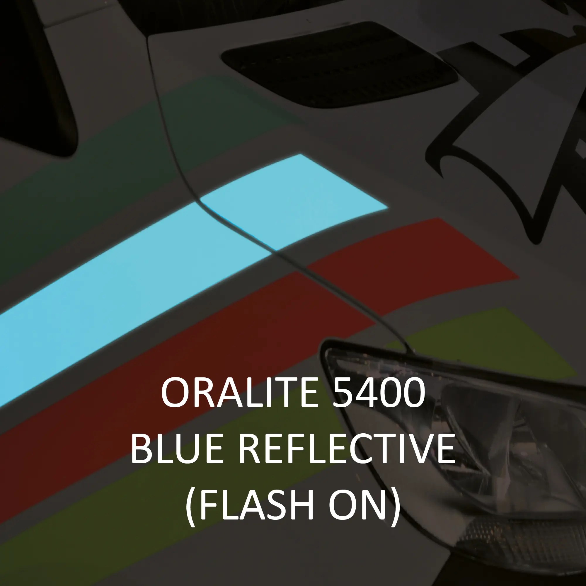 ORALITE 5400 Commercial Grade reflective vehicle vinyls used on the side bonnet of an APS delivery van, with special focus on the impressive 5400-050 Blue coloured decal which is brightly reflecting the blue light back as the camera flash illuminates the film.