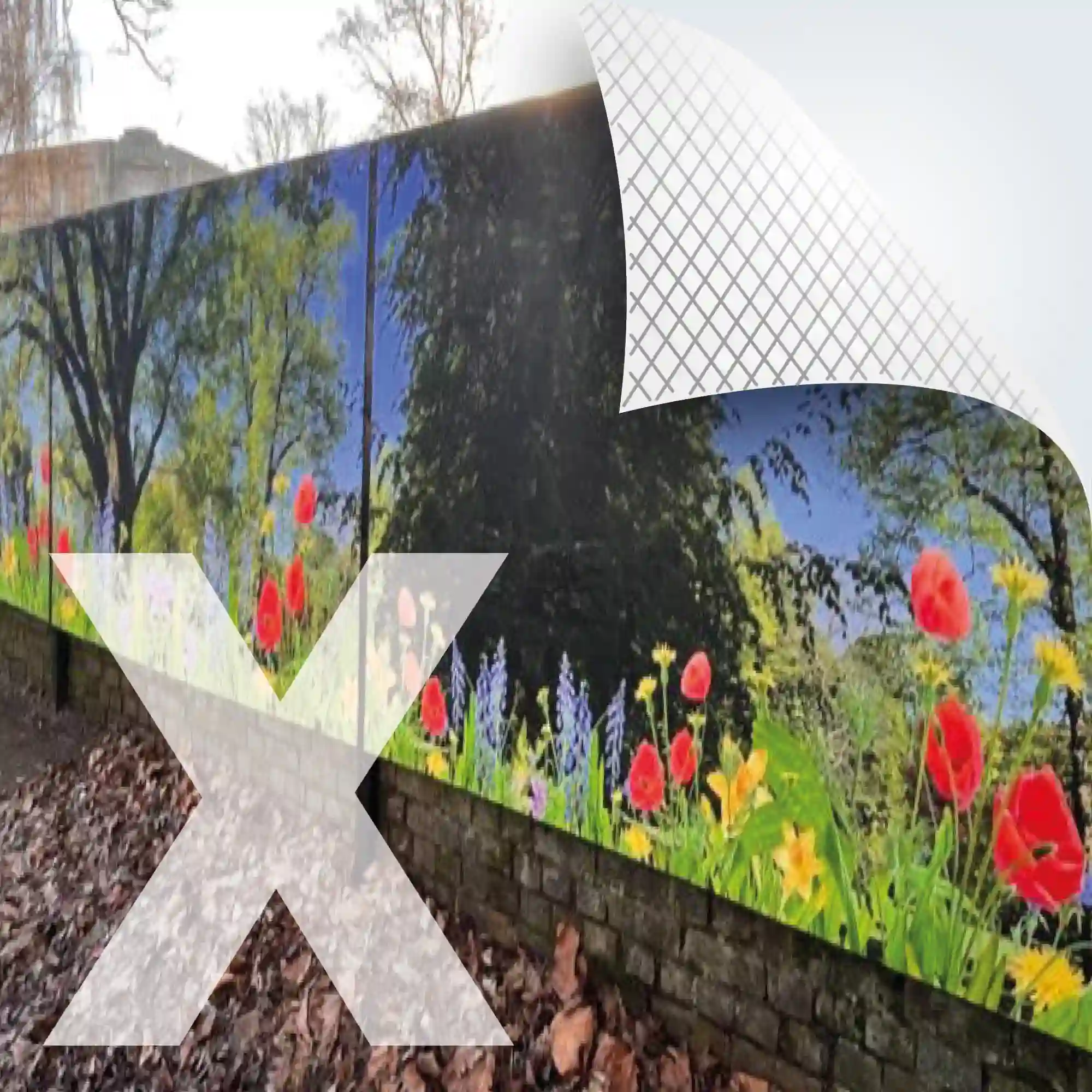 NU-COAT P12-P-X polymeric self-adhesive bubble-free graphics vinyl is mounted onto display boards fixed to an exterior wall, featuring a printed image of a wide angle photograph of a peaceful field of red poppies and yellow daffodils with dark green trees in the background.