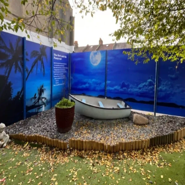 NU-COAT P15-P-P matt white polymeric print vinyl is a self-adhesive digital graphics film that is pictured here with a printed photograph of a nightime image of palm trees and clouds in the night sky with the moon's light at the centre of the display, printed in calming blue and black tones.