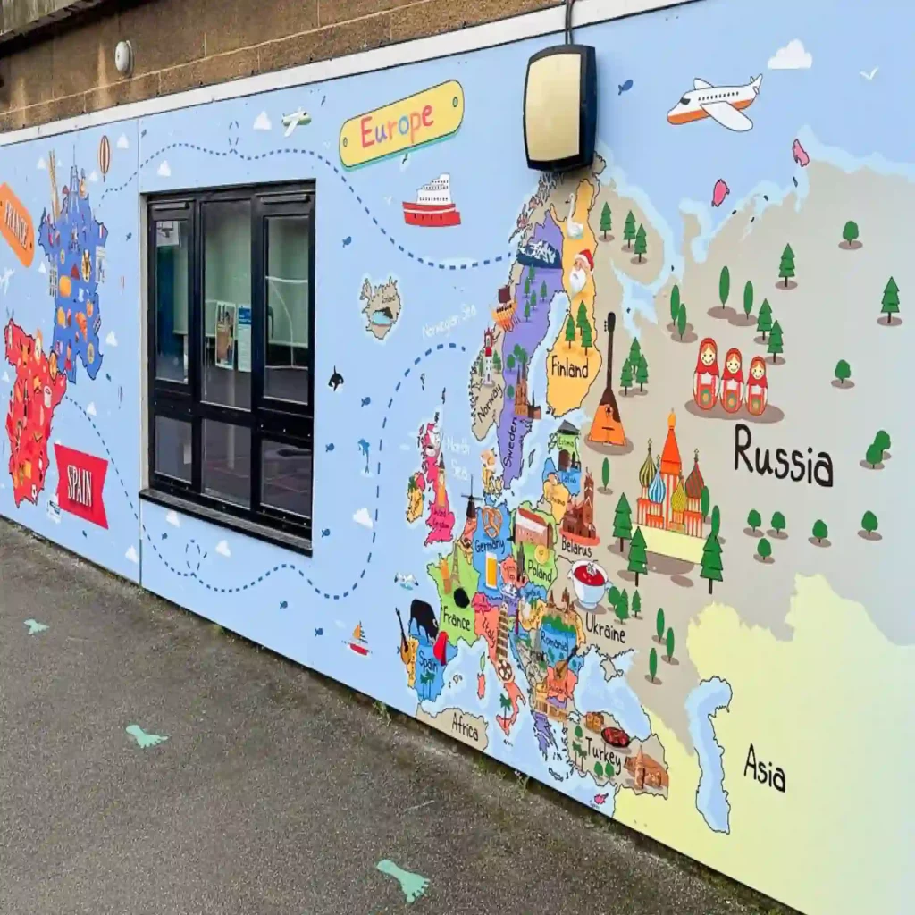 NU-COAT P21-P transparent gloss polymeric graphics film has been used to laminate thisexternal school hoarding print, protecting the film from UV light and general wear and tear. The printed image is educational, showing a map of the routes of peoples' past migrations from the European continent to different areas of the globe.