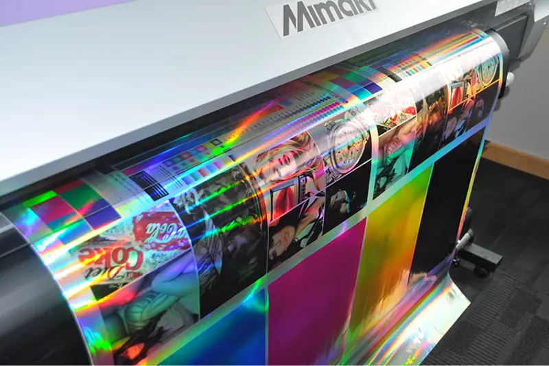 Printing a colour profile test print on a Mimaki printer loaded with Rainbow Bright decorative reflective chroma self-adhesive media.