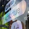 RH50 Silver Holographic cut-vinyl signage applied to high street window with a subtle metallised rainbow effect as the reflected light subtly changes the colour of the film.