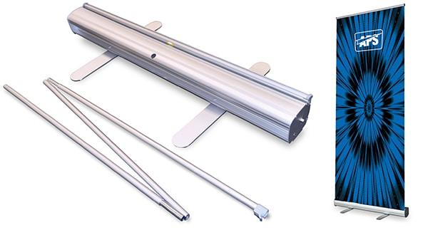 A photo of the silver Altona Two pull-up display stand standing upright on the right of the image with the printed graphic fully extended in the roll-up banner stand. To the left of the image is a close-up to show the detail of the metal pull-up banner graphics cartridge before the banner stand is assembled and the roll up graphic is pulled up into place. The grey metal 3 part pole with the bungee attachments are in the foreground and the cassette for the graphics is shown with the two swivel feet extended.