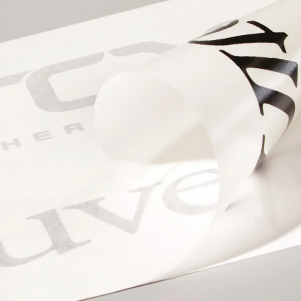 RTape 4885 RLA graphics transfer application paper being used to transfer small, intricate cut-vinyl lettering from the sign vinyl release liner onto the final application surface.