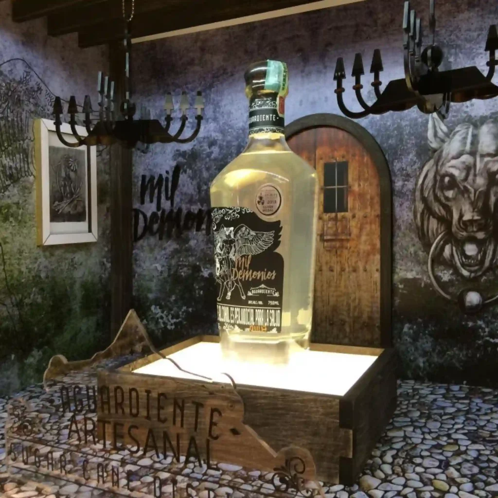 Self-adhesive print film, Mactac JT 8500 WM-PT, printed with a dungeon styled theme for a beverage products retail window display that is applied onto all the flat surfaces of this large storefront display.