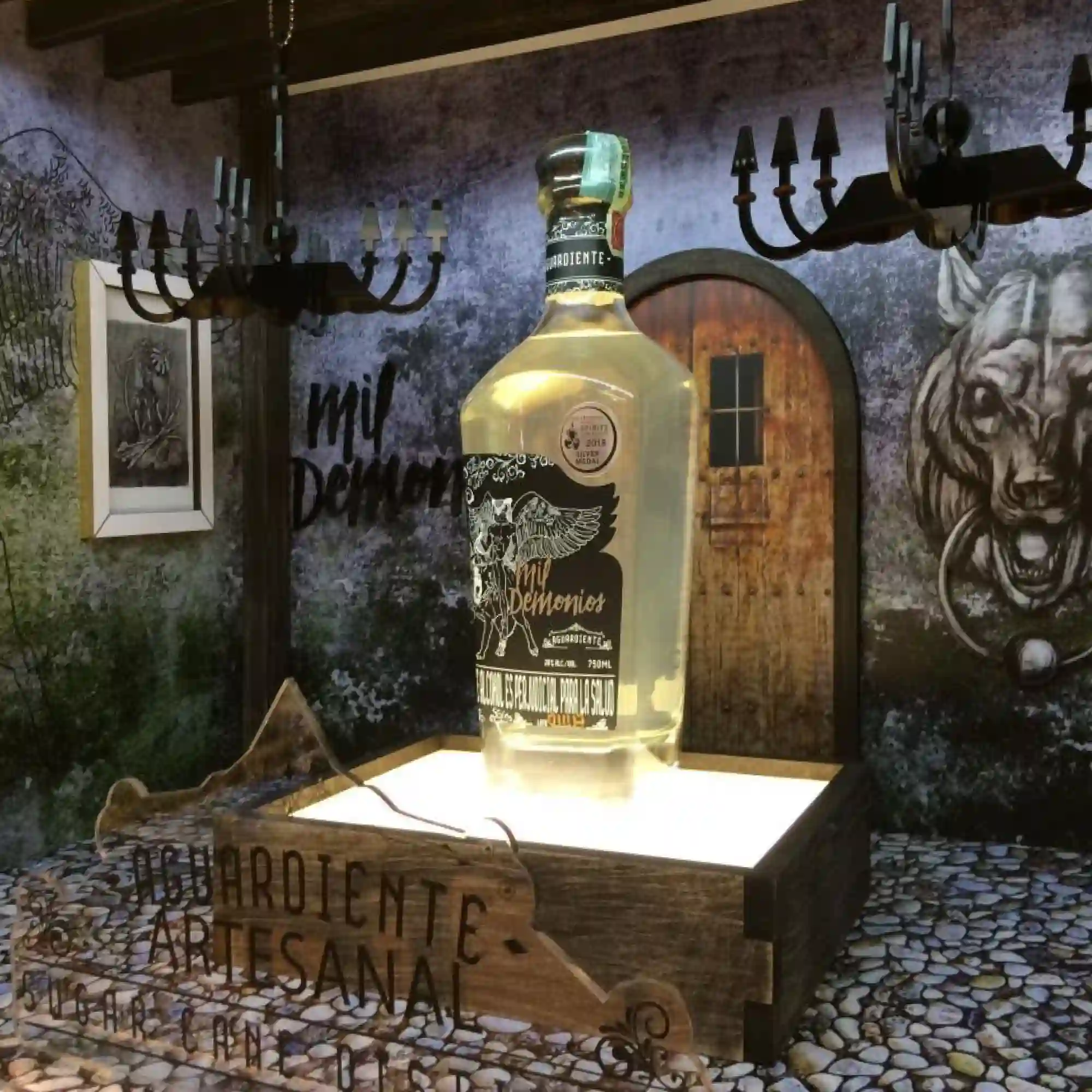 Self-adhesive print film, Mactac JT 8500 WM-PT, printed with a dungeon styled theme for a beverage products retail window display that is applied onto all the flat surfaces of this large storefront display.