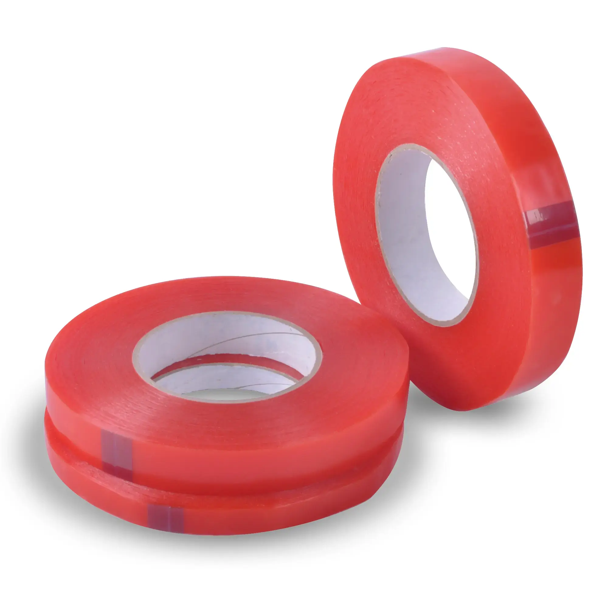 Three different width sizes of DSC-2065F clear double-sided high tack sign tape shown in their reeled rolls, two of the reel widths are on their side, horizontally stacked on top of each other, and the third reel is offset to the side standing upright on it's short edge. Clear tape with a red release liner gives these rolls their distinctive bright colour prior to liner removal and installation.