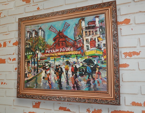 Sihl Picasso Canvas artist reproduction print of a Moulin Rouge fine art painting in a carved wooden frame tastefully displayed onto a brick wall.