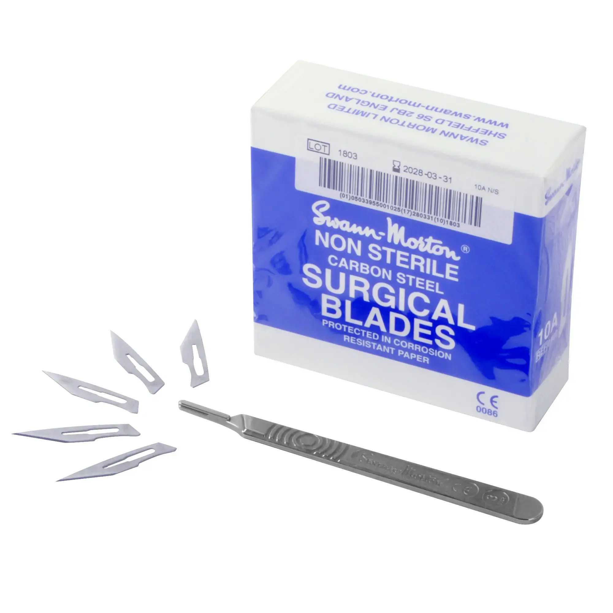 Swann Morton scalpel handle for graphic artists, positioned in front of a box of replacement blades and 5 unattached blades fanned out at the pointy end of the scalpel to indicate the end of the handle the blades will slot into.