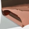 T72-P Bright Two-Way Rose Gold self-adhesive metallised graphics vinyl with the face film pulled back to reveal the carrier-liner behind showing both sides of the film look identical on the face and on the back (adhesive side) meaning it can be used as a two-way viewable window film.