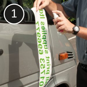 Wet apply sign vinyl: spray app fluid onto substrate and adhesive