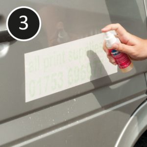 Wet apply sign vinyl: re-spray app tape over graphic