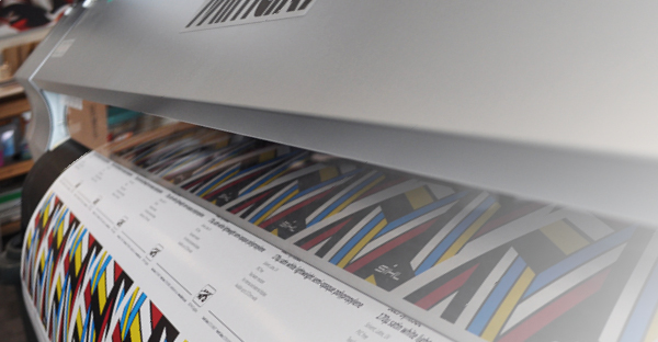 TSSP225 satin photo paper for wide format digital printers is shown printing a colourful, bright abstract poster graphic on a Mimaki large-format printer.